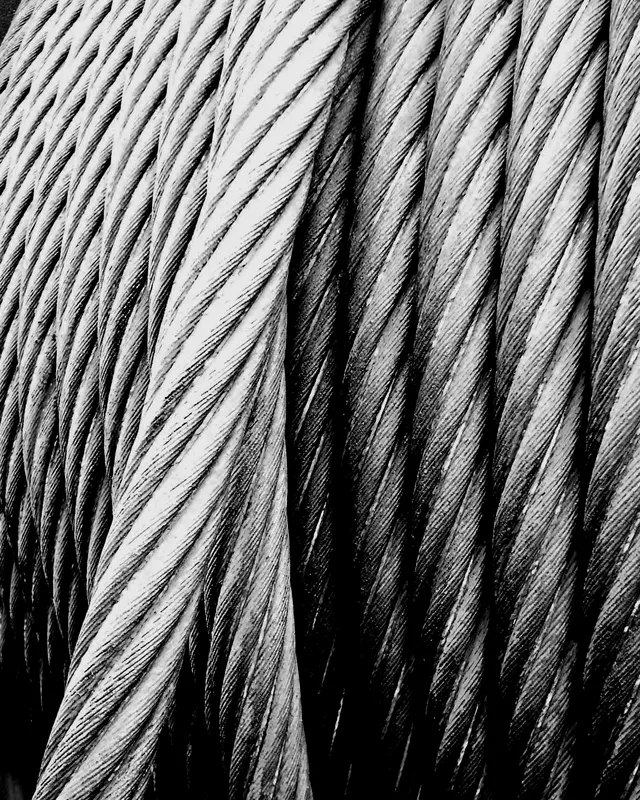 Cross-section of a stranded steel wire lift rope showing strands around the core