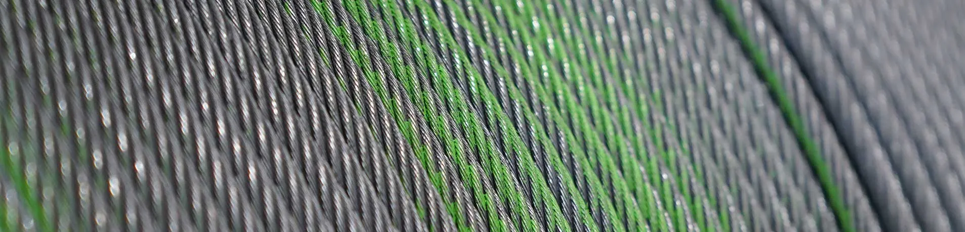 Steel wire lift rope in close-up — the crown wires that carry groove contact